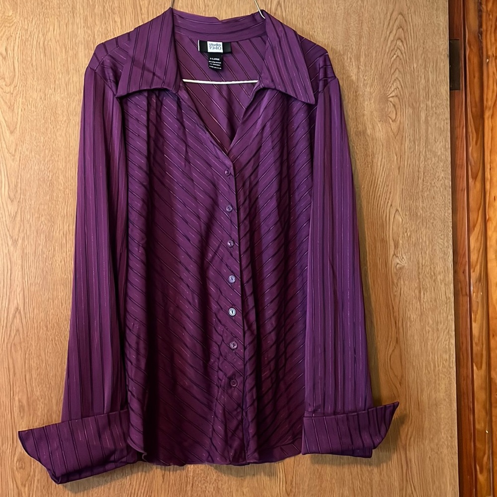Purple and black button up, collared blouse.